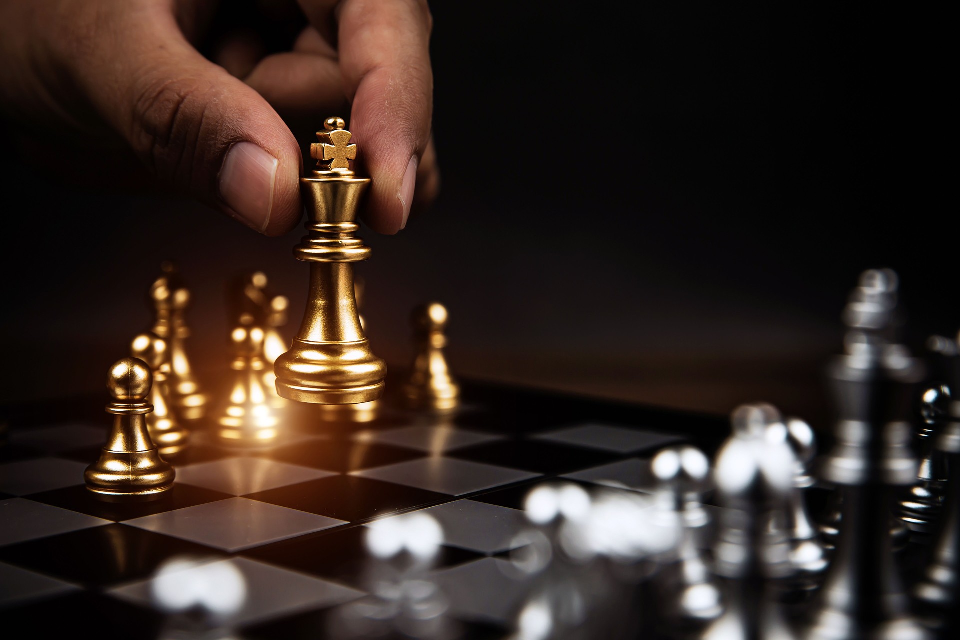 Close up king chess challenge or battle fighting with falling chess on chess board concepts of leadership and strategy or strategic plan and human resource or risk management or team player.